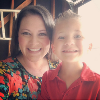 Woman in flower shirt with boy in red collared shirt