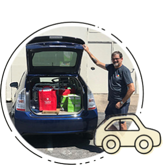 Man opening the trunk of his car with CareBOX items inside