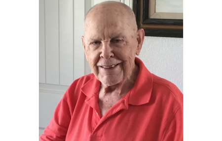 Man in red shirt smiling