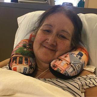 Woman in striped shirt with neck pillow